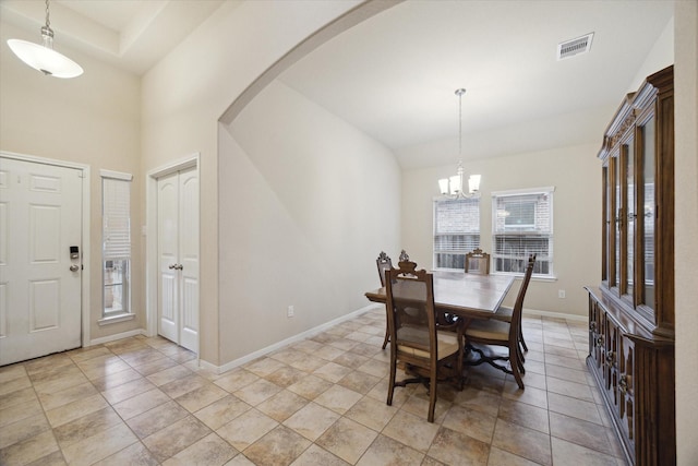 3707 Daintree Park Dr, Katy, TX 77494 - dining area featuring arched walkways, baseboards, and a chandelier
