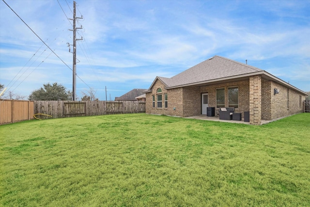 3707 Daintree Park Dr, Katy, TX 77494 - back of house with brick siding, roof with shingles, a patio area, and an outdoor living space