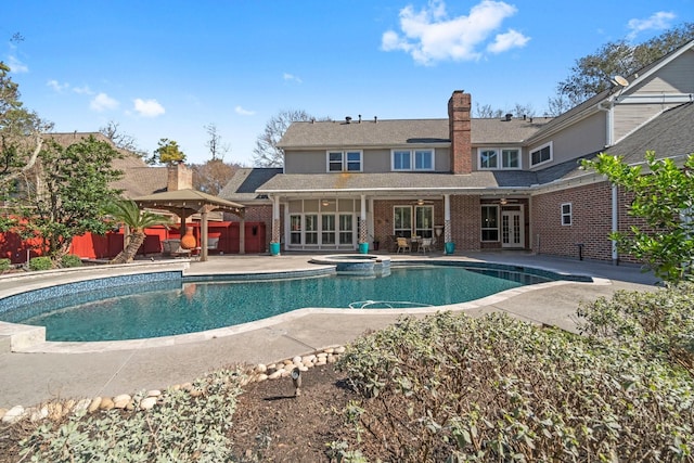 11407 Squiredale Dr, Houston, TX 77070 - view of swimming pool featuring french doors, a patio area, and a pool with connected hot tub