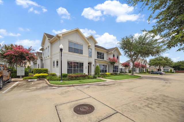 4319 Stonebrook Ln, Missouri City, TX 77459 - view of front facade with stucco siding and uncovered parking