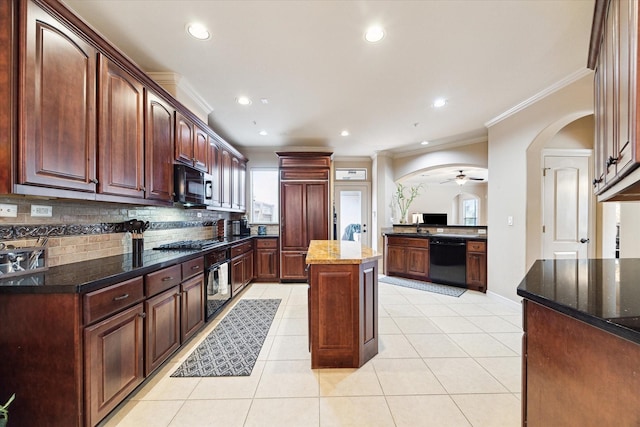 4319 Stonebrook Ln, Missouri City, TX 77459 - kitchen with black appliances, crown molding, arched walkways, backsplash, and dark stone countertops