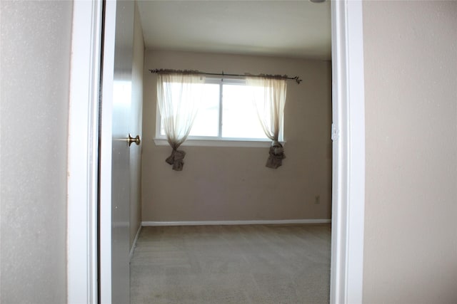 10001 Westpark Dr Unit 25, Houston, TX 77042 - unfurnished room featuring light carpet and baseboards