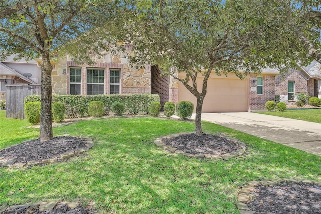 2602 Tacoma Springs Dr, Conroe, TX 77304 - obstructed view of property with concrete driveway, brick siding, and an attached garage