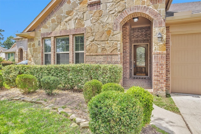 2602 Tacoma Springs Dr, Conroe, TX 77304 - doorway to property with stone siding, brick siding, and a garage