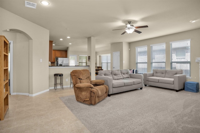 2602 Tacoma Springs Dr, Conroe, TX 77304 - living area featuring arched walkways, a ceiling fan, light tile patterned floors, recessed lighting, and baseboards