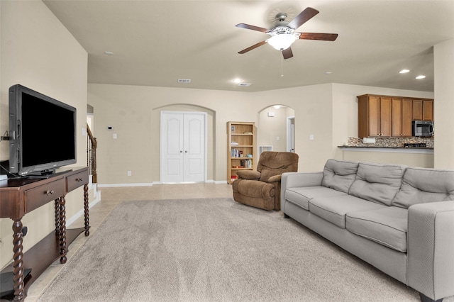 2602 Tacoma Springs Dr, Conroe, TX 77304 - living room with arched walkways, ceiling fan, recessed lighting, and baseboards