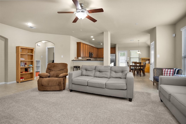 2602 Tacoma Springs Dr, Conroe, TX 77304 - living area featuring ceiling fan, arched walkways, and recessed lighting