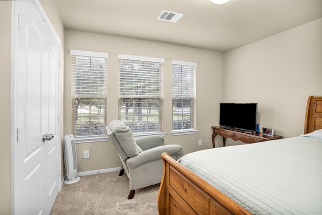 2602 Tacoma Springs Dr, Conroe, TX 77304 - bedroom with light colored carpet, heating unit, and baseboards