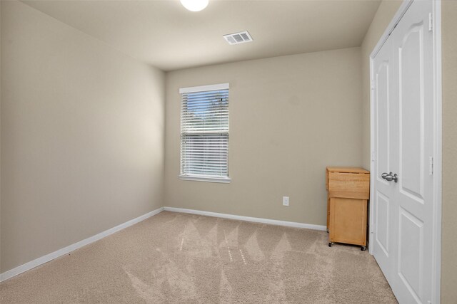 2602 Tacoma Springs Dr, Conroe, TX 77304 - unfurnished bedroom featuring baseboards and light colored carpet