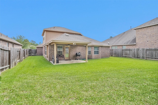 2602 Tacoma Springs Dr, Conroe, TX 77304 - back of house featuring a patio area, brick siding, and roof with shingles