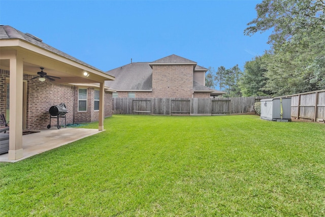 2602 Tacoma Springs Dr, Conroe, TX 77304 - view of yard with ceiling fan, a patio, and a shed