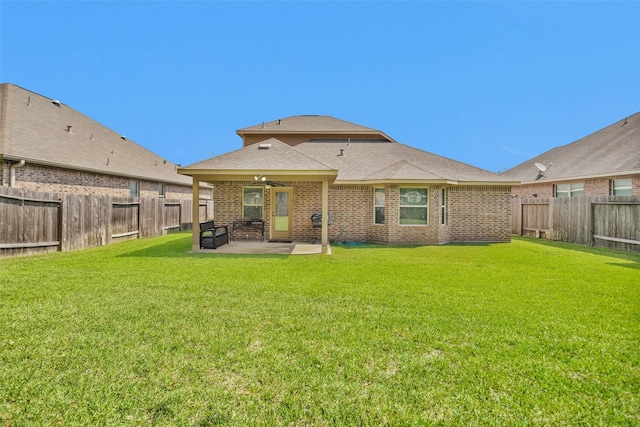 2602 Tacoma Springs Dr, Conroe, TX 77304 - back of house with a patio, a ceiling fan, a shingled roof, and brick siding