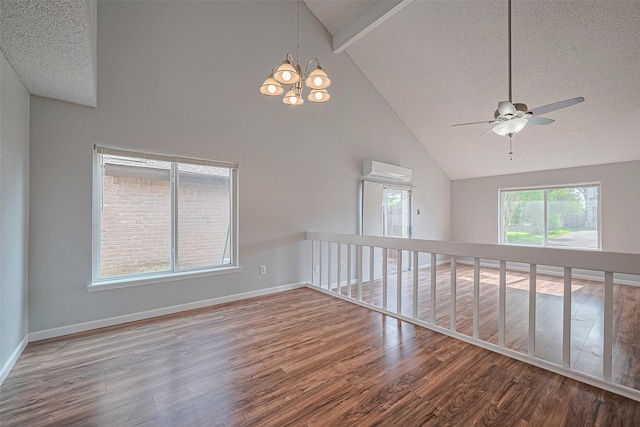 1806 Foxlake Dr, Houston, TX 77084 - unfurnished room featuring wood finished floors, a textured ceiling, an AC wall unit, high vaulted ceiling, and ceiling fan