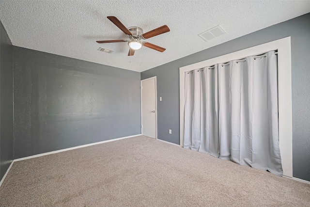 1806 Foxlake Dr, Houston, TX 77084 - carpeted empty room with a ceiling fan, a textured ceiling, and baseboards
