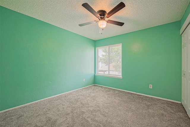 1806 Foxlake Dr, Houston, TX 77084 - spare room with a textured ceiling, carpet flooring, ceiling fan, and baseboards