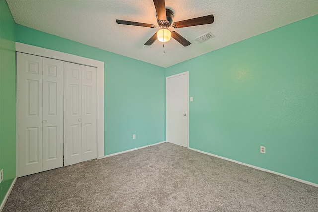 1806 Foxlake Dr, Houston, TX 77084 - unfurnished bedroom featuring carpet, a closet, a textured ceiling, baseboards, and ceiling fan