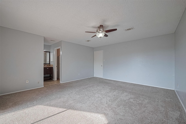 1806 Foxlake Dr, Houston, TX 77084 - empty room with a ceiling fan, carpet floors, baseboards, and a textured ceiling