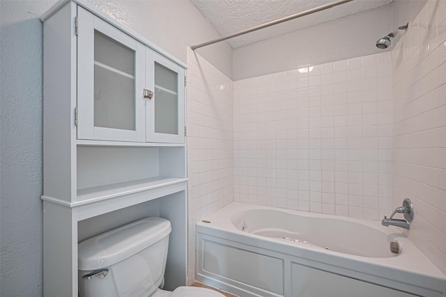 1806 Foxlake Dr, Houston, TX 77084 - bathroom with toilet, shower / tub combination, a textured ceiling, and a textured wall
