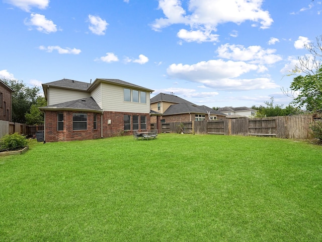 4015 Candle Cove Ct, Sugar Land, TX 77479 - rear view of house featuring brick siding and roof with shingles