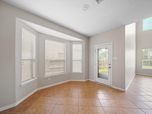 4015 Candle Cove Ct, Sugar Land, TX 77479 - entryway featuring light tile patterned floors and baseboards
