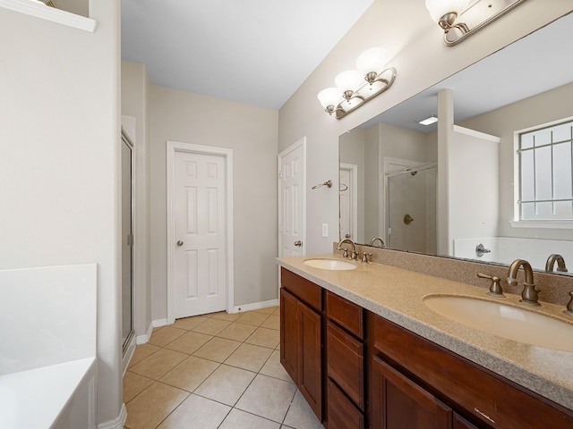 4015 Candle Cove Ct, Sugar Land, TX 77479 - bathroom featuring a stall shower, tile patterned flooring, double vanity, and baseboards