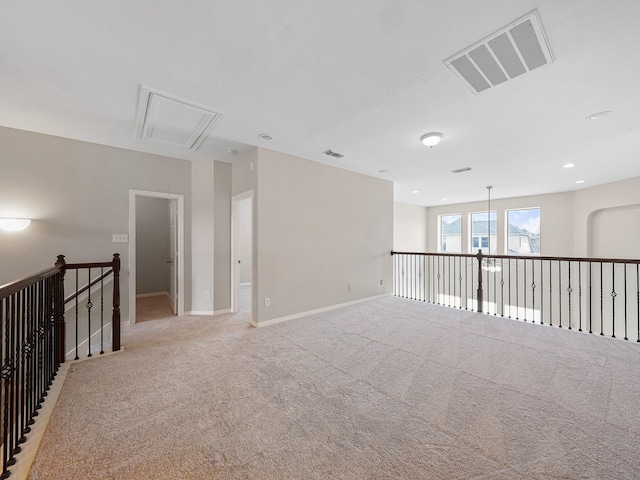 4015 Candle Cove Ct, Sugar Land, TX 77479 - empty room with attic access, light carpet, and baseboards