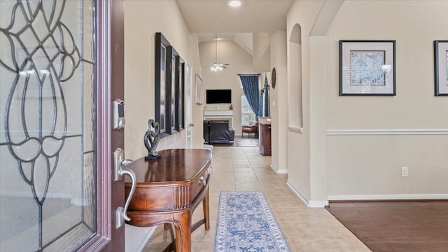13822 Birney Point Ln, Houston, TX 77044 - foyer entrance featuring light tile patterned floors, ceiling fan, and baseboards