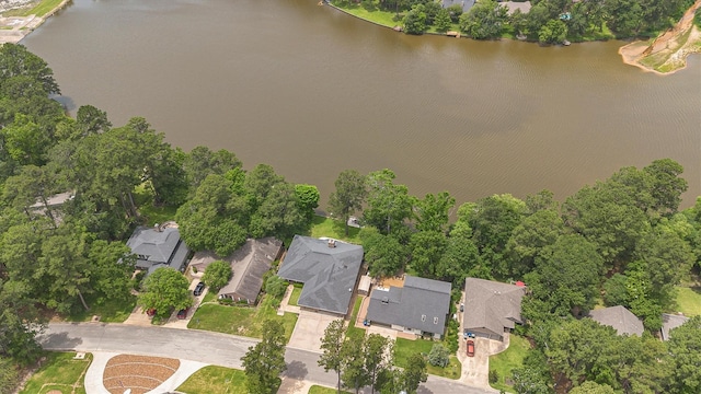 1927 E Lake Dr, Huntsville, TX 77340 - aerial overview of property's location featuring a large body of water, nearby suburban area, and a tree filled landscape