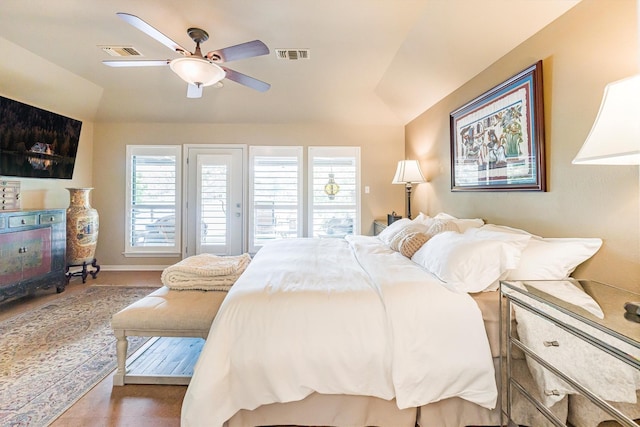 1927 E Lake Dr, Huntsville, TX 77340 - bedroom featuring multiple windows, lofted ceiling, ceiling fan, and access to outside