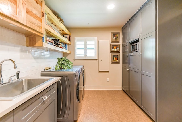 1927 E Lake Dr, Huntsville, TX 77340 - washroom featuring cabinet space, independent washer and dryer, baseboards, light flooring, and recessed lighting