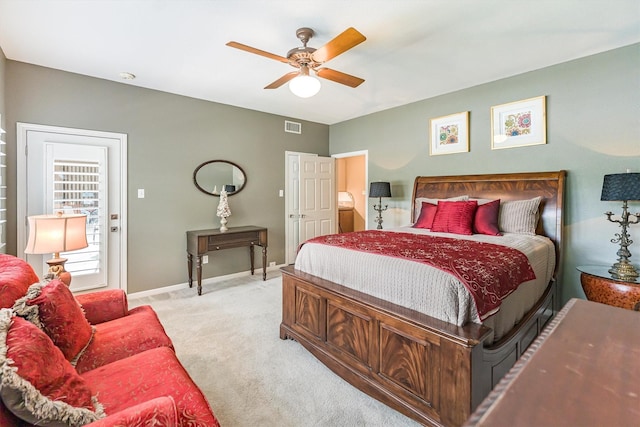 1927 E Lake Dr, Huntsville, TX 77340 - bedroom featuring light carpet, baseboards, and a ceiling fan
