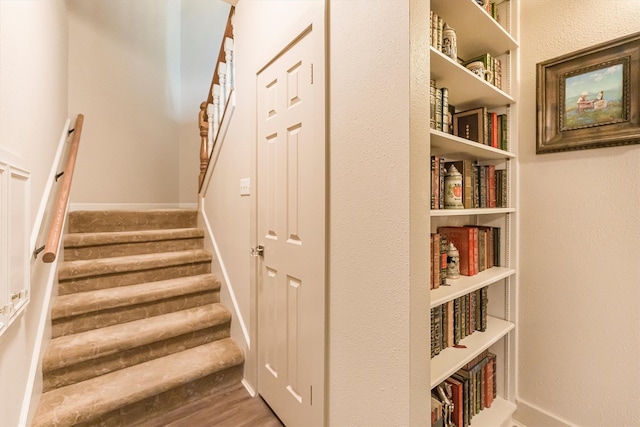1927 E Lake Dr, Huntsville, TX 77340 - staircase featuring wood finished floors and baseboards