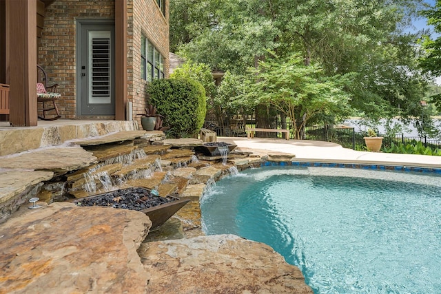 1927 E Lake Dr, Huntsville, TX 77340 - view of swimming pool featuring a patio area