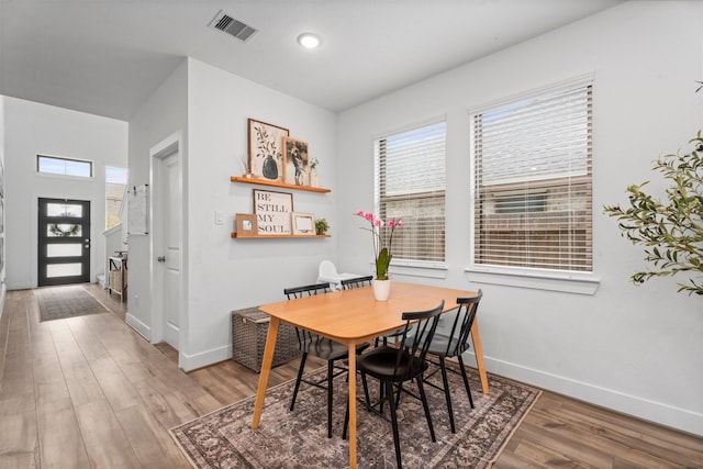 19180 Cedar Lennox Cir, Magnolia, TX 77355 - dining area with baseboards, wood finished floors, and recessed lighting