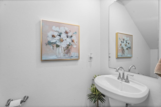 19180 Cedar Lennox Cir, Magnolia, TX 77355 - bathroom featuring a sink and lofted ceiling
