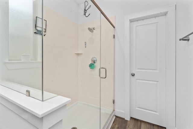 19180 Cedar Lennox Cir, Magnolia, TX 77355 - bathroom with a shower stall and wood finished floors