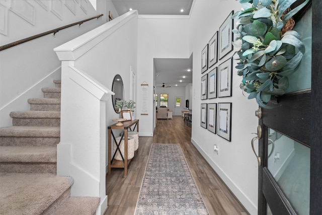 19180 Cedar Lennox Cir, Magnolia, TX 77355 - entrance foyer featuring stairway, wood finished floors, a high ceiling, baseboards, and recessed lighting