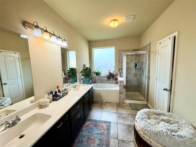 1315 Maple Ace Dr, Katy, TX 77493 - bathroom with a garden tub, double vanity, a shower stall, and tile patterned floors