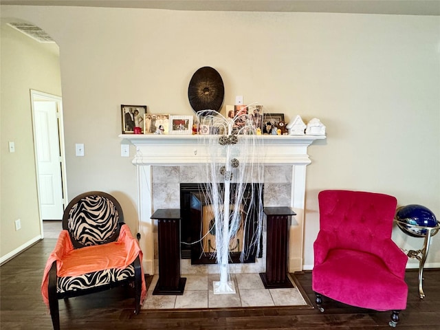 1315 Maple Ace Dr, Katy, TX 77493 - sitting room featuring a high end fireplace, wood finished floors, baseboards, and arched walkways
