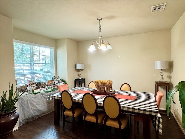 1315 Maple Ace Dr, Katy, TX 77493 - dining room with a chandelier and wood finished floors