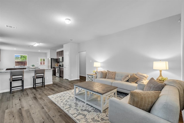 25424 Grotto Falls Ln, Porter, TX 77365 - living room with wood finished floors and baseboards