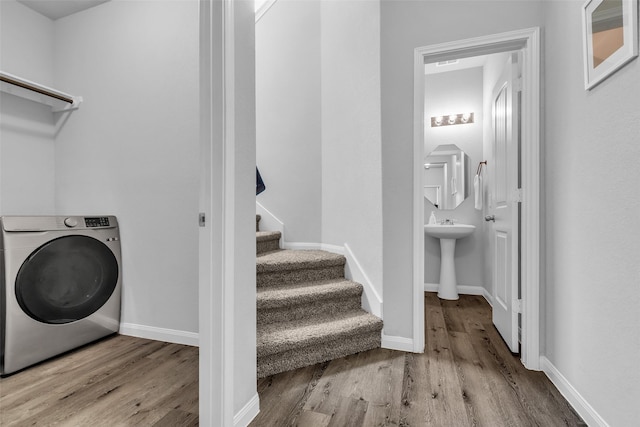 25424 Grotto Falls Ln, Porter, TX 77365 - laundry room featuring washer / dryer, wood finished floors, and baseboards