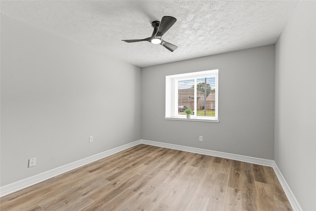 10503 Long River Dr, Sugar Land, TX 77498 - empty room featuring light wood finished floors, a textured ceiling, baseboards, and ceiling fan