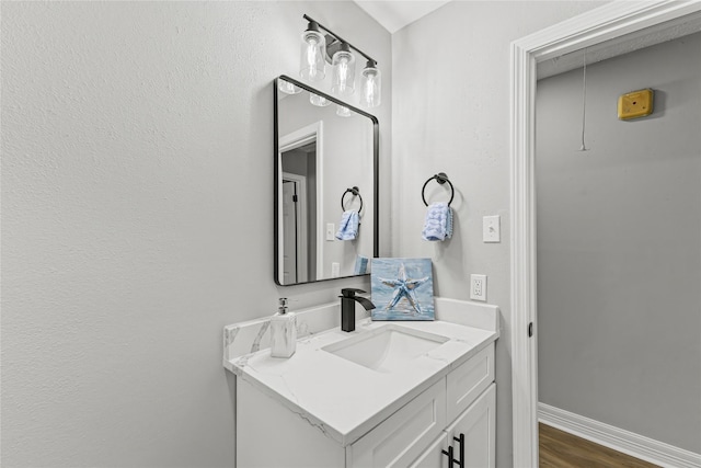 10503 Long River Dr, Sugar Land, TX 77498 - bathroom featuring vanity, wood finished floors, and baseboards