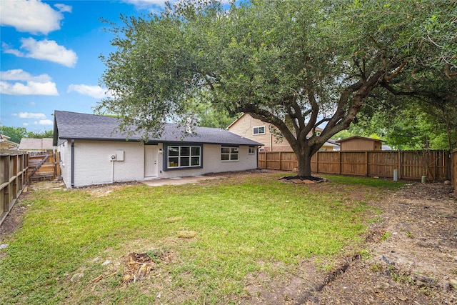 10503 Long River Dr, Sugar Land, TX 77498 - back of property with brick siding, a shingled roof, and a patio area