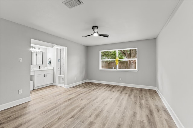 10503 Long River Dr, Sugar Land, TX 77498 - unfurnished bedroom with light wood finished floors, baseboards, ensuite bath, and a ceiling fan