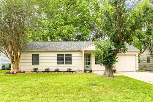 228 Laurel St, Lake Jackson, TX 77566 - ranch-style home featuring driveway, an attached garage, a front lawn, and roof with shingles