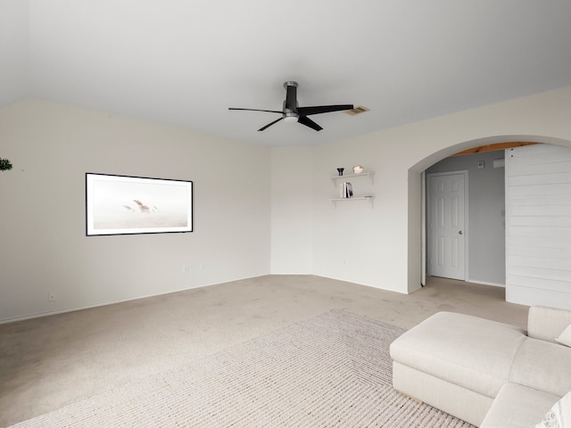 2965 Rustic Pier Ln, League City, TX 77573 - unfurnished living room featuring light carpet, ceiling fan, and arched walkways