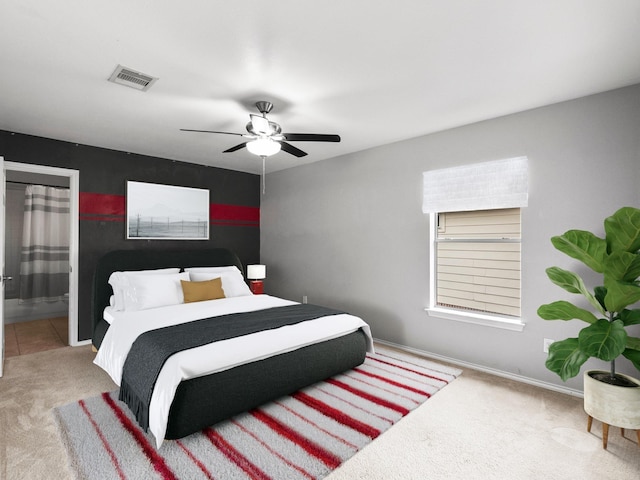 2965 Rustic Pier Ln, League City, TX 77573 - bedroom with carpet, ceiling fan, baseboards, and ensuite bath