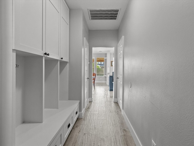 2965 Rustic Pier Ln, League City, TX 77573 - mudroom featuring baseboards and light wood-style floors
